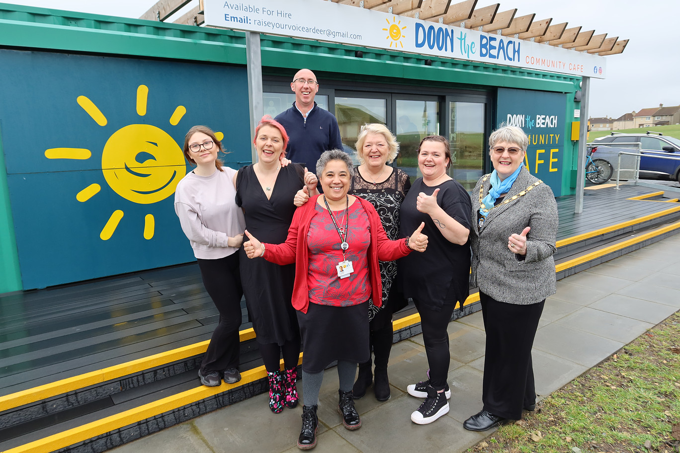 Group of people in front of Stevenson Community Hub and Doon the Beach community cafe