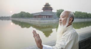 Senior man practising Tai Chi