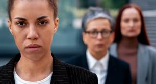 Three women looking at camera