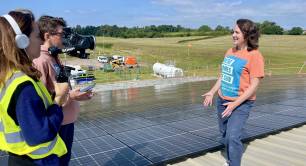 BEC staff with solar rooftop array on GWAAC (mobile pic).Copyright BEC.Copyright BEC.jpg