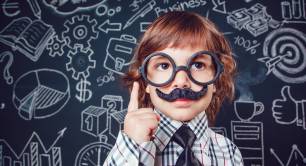 Little boy as businessman or teacher with mustache and glasses